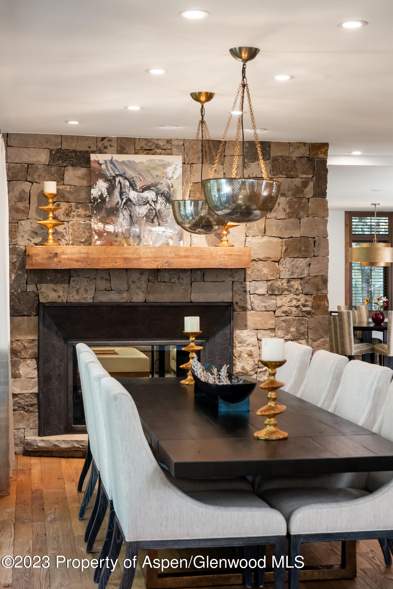 970 Powder Lane Aspen, CO 81611 - Photo 15 of 68 a view of a dining room with a table and chairs