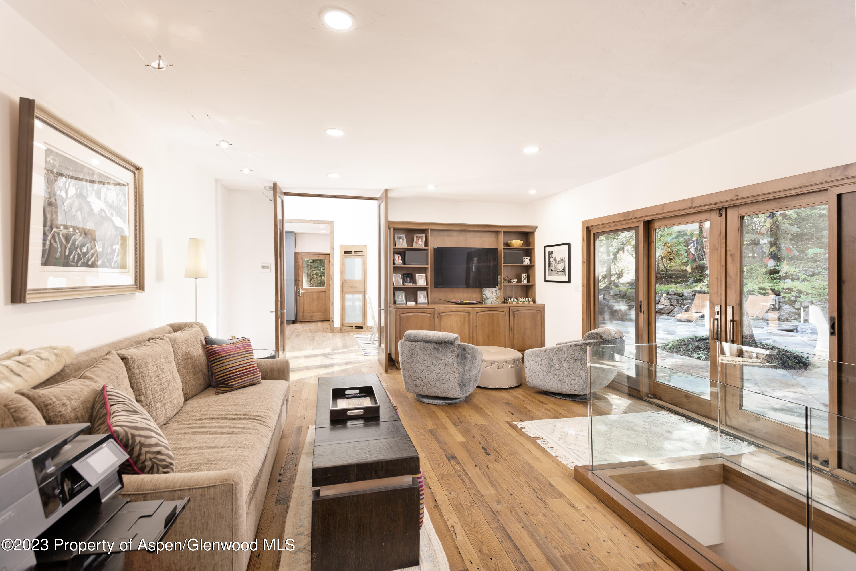970 Powder Lane Aspen, CO 81611 - Photo 21 of 68 a living room with furniture and a large window