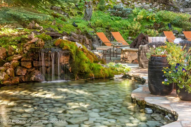a white bath tub sitting in a bathroom next to a window