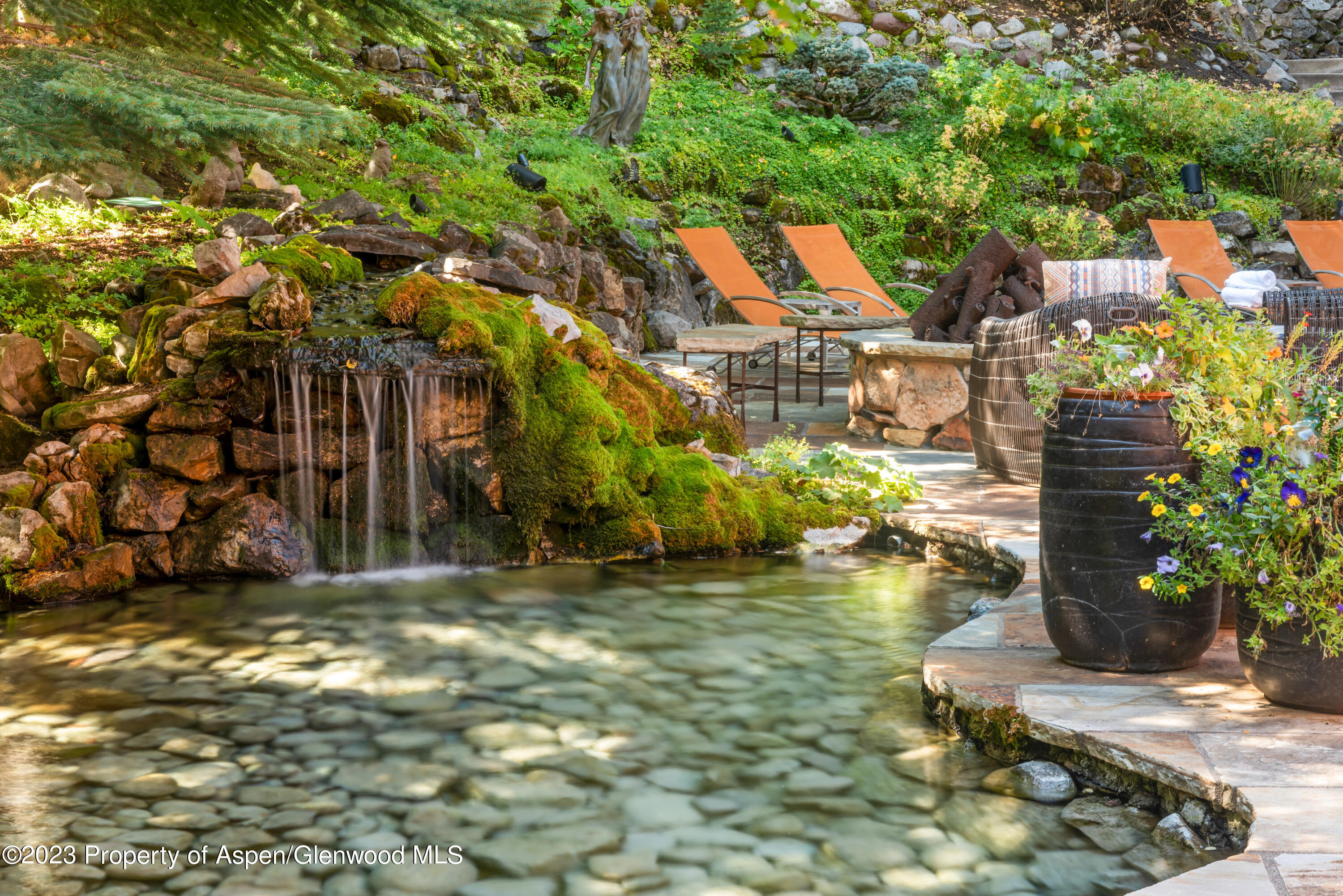 970 Powder Lane Aspen, CO 81611 - Photo 23 of 68 a backyard of a house with lots of green space