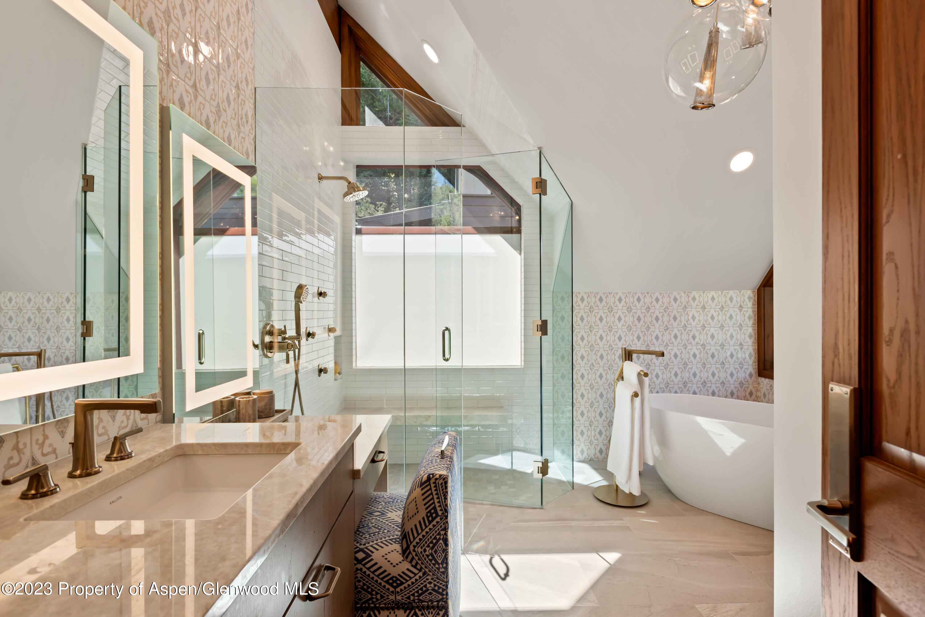 970 Powder Lane Aspen, CO 81611 - Photo 30 of 68 a spacious bathroom with a large tub and shower