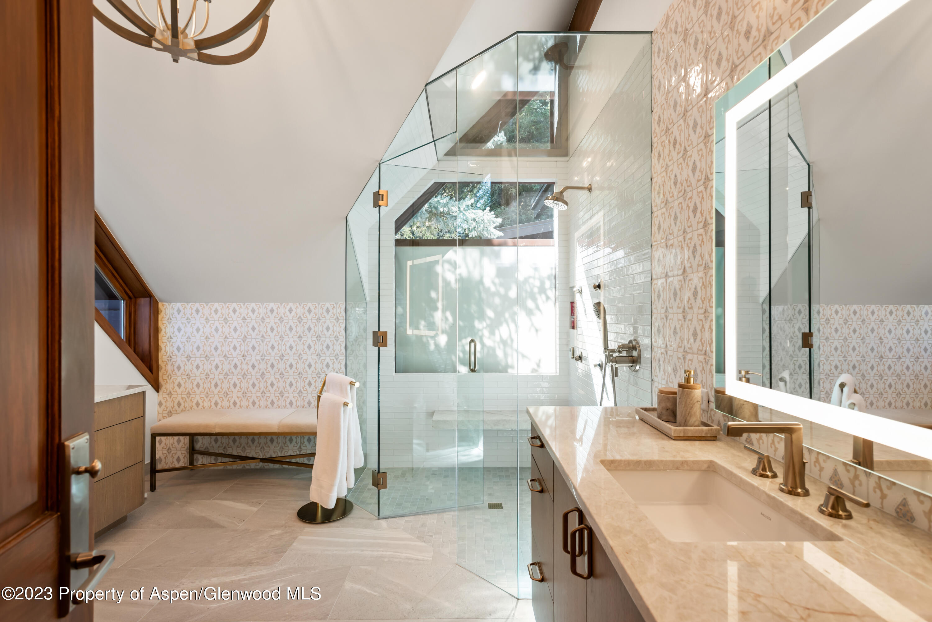 970 Powder Lane Aspen, CO 81611 - Photo 32 of 68 a bathroom with a tub sink and mirror