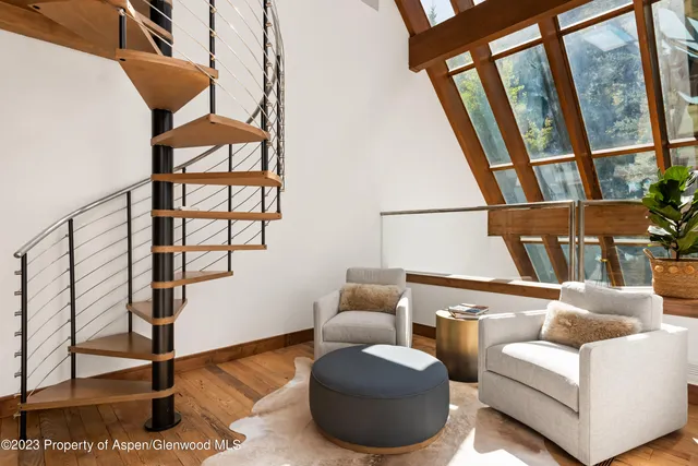 a living room with fireplace furniture and a flat screen tv