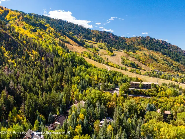 a living room with fireplace furniture and a flat screen tv