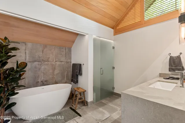 a bathroom with a sink toilet and mirror