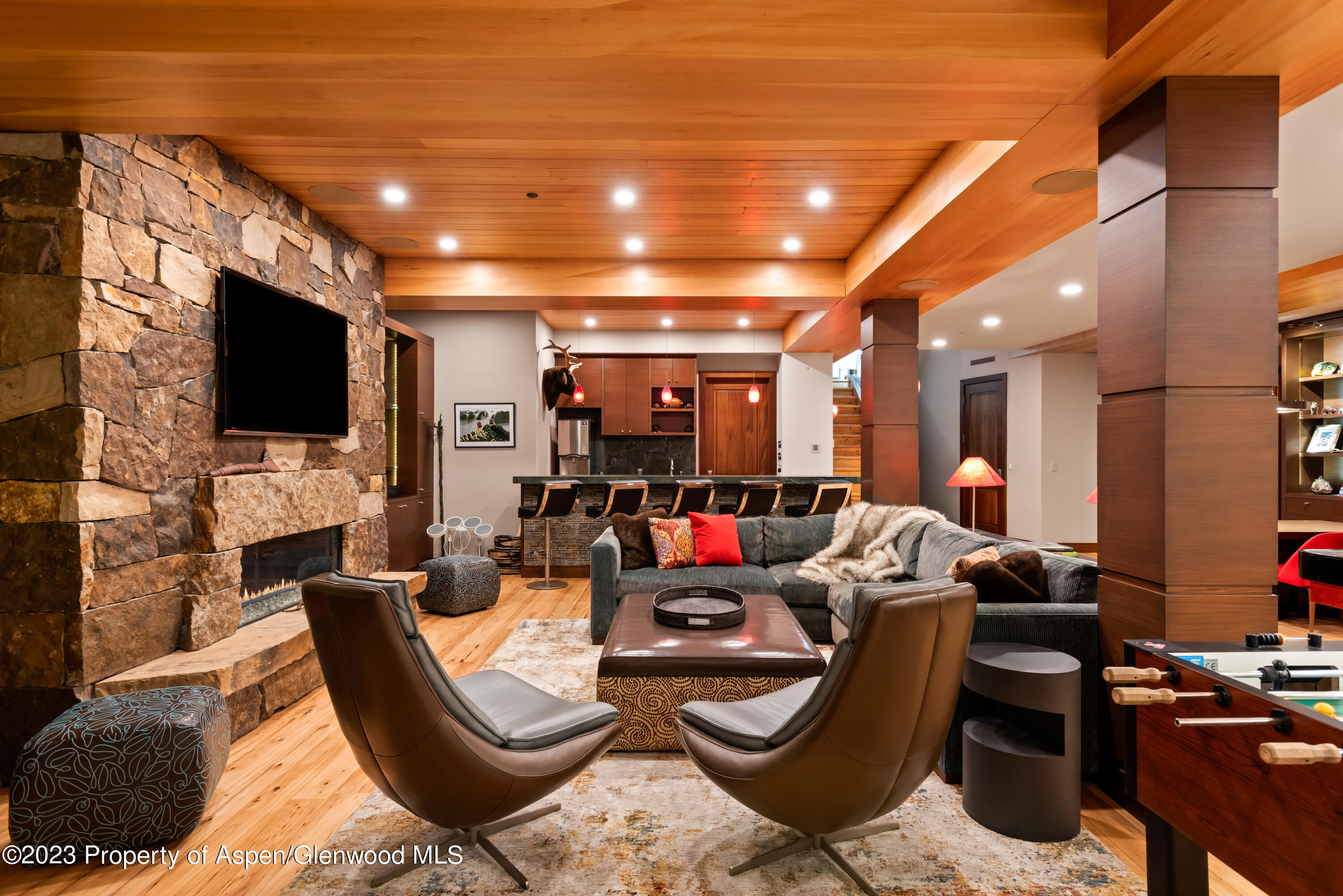 970 Powder Lane Aspen, CO 81611 - Photo 48 of 68 a living room with furniture and a flat screen tv