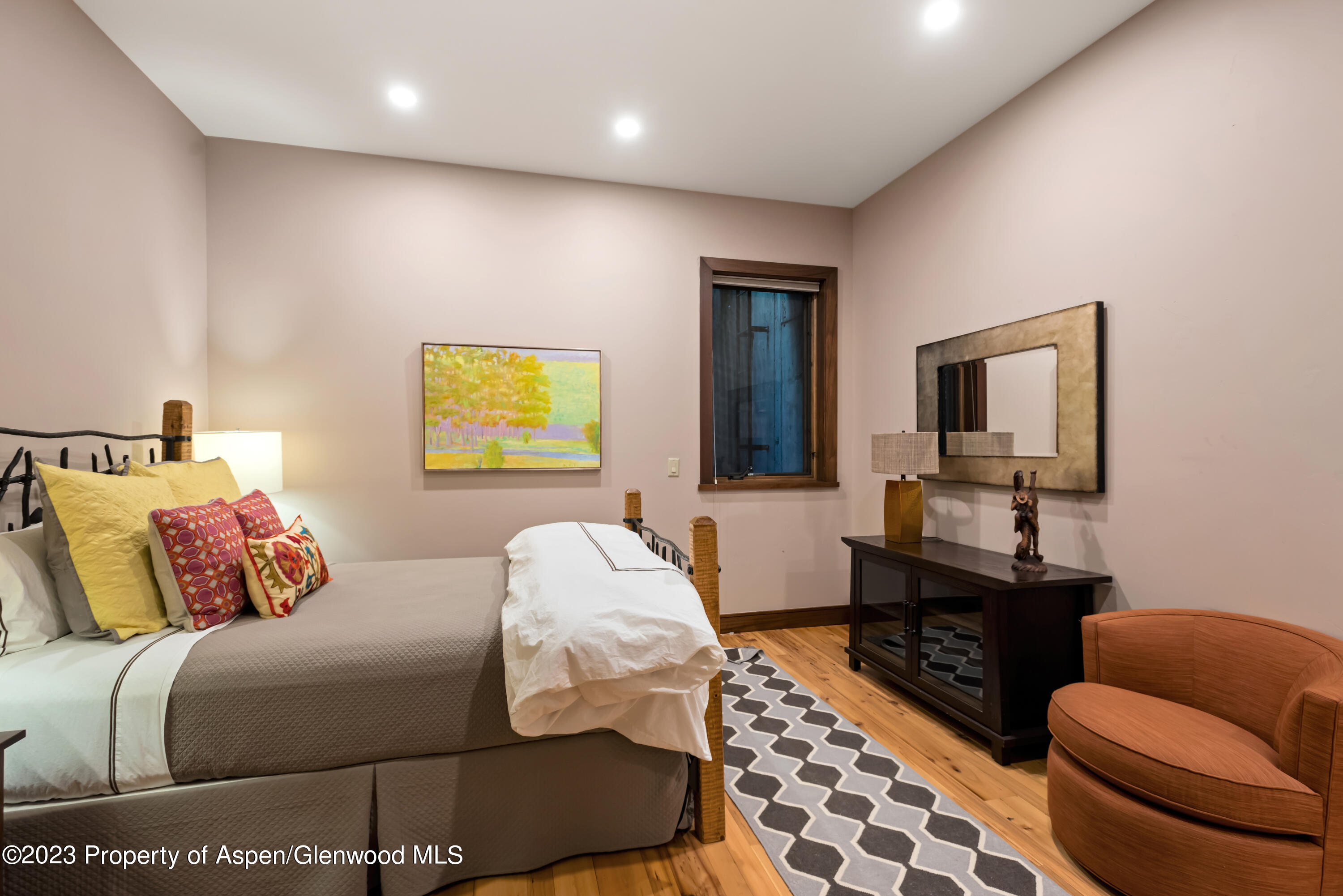 970 Powder Lane Aspen, CO 81611 - Photo 55 of 68 a bedroom with furniture and a window