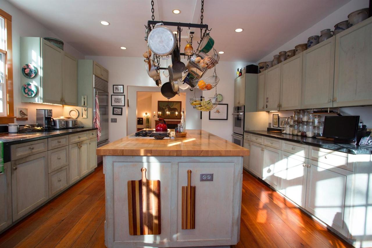 1 Nelson Drive Truro, MA 02666 - Photo 11 of 33 a kitchen with stainless steel appliances granite countertop a sink a stove and a wooden floors