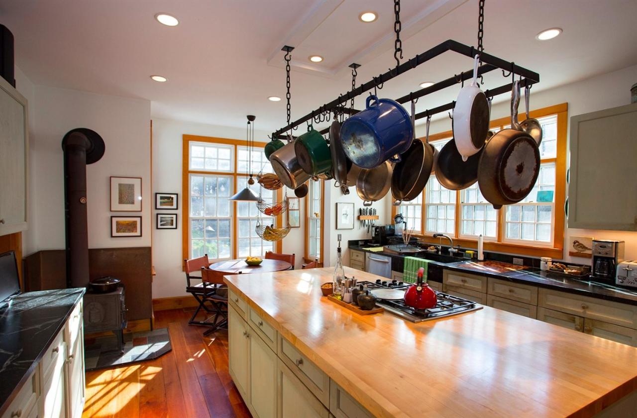 1 Nelson Drive Truro, MA 02666 - Photo 12 of 33 a kitchen with a stove and a wooden floor
