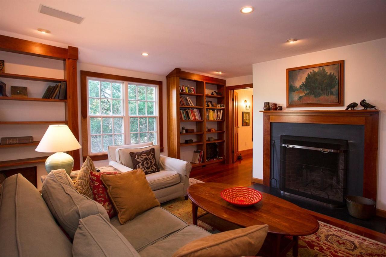 1 Nelson Drive Truro, MA 02666 - Photo 18 of 33 a living room with furniture a flat screen tv and a fireplace