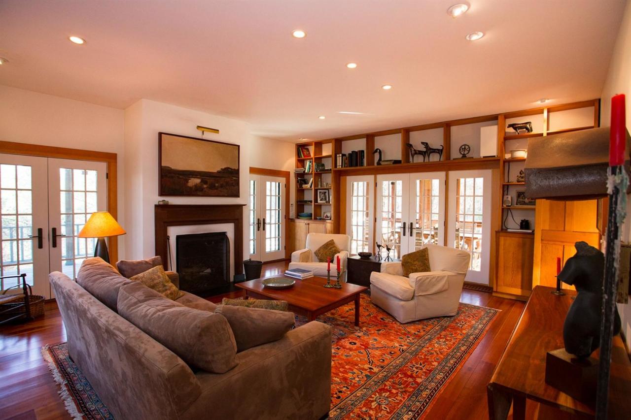 1 Nelson Drive Truro, MA 02666 - Photo 19 of 33 a living room with furniture a fireplace and a flat screen tv
