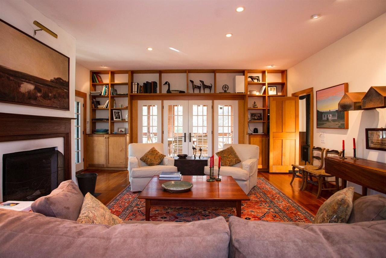 1 Nelson Drive Truro, MA 02666 - Photo 20 of 33 a living room with furniture large window and fireplace