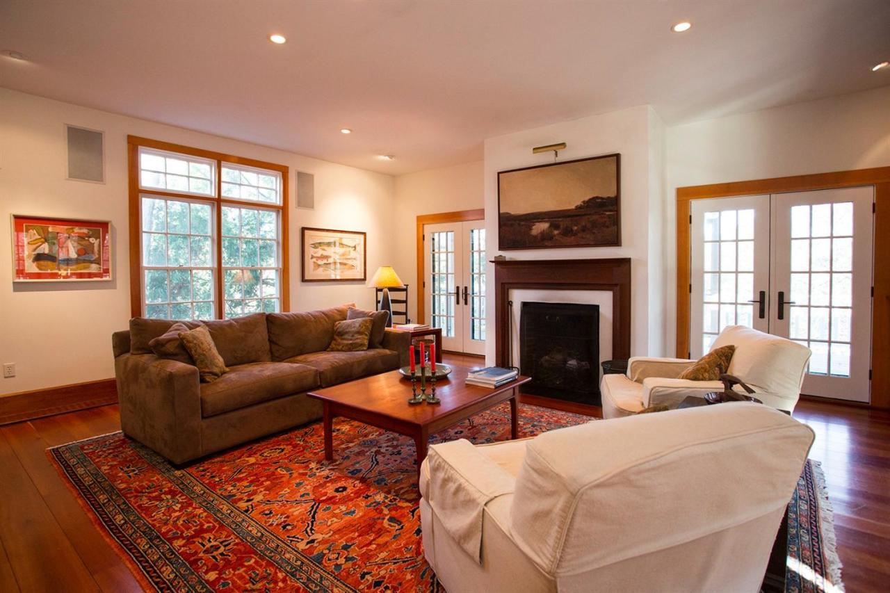 1 Nelson Drive Truro, MA 02666 - Photo 21 of 33 a living room with furniture a large window and a fireplace