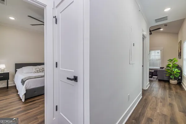 a view of a bedroom from a hallway