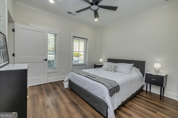 a bedroom with a bed and window