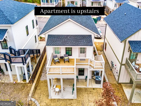 a view of residential houses with wooden stairs