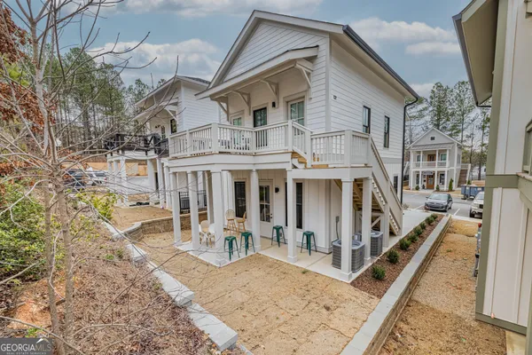 a view of multiple houses with a street