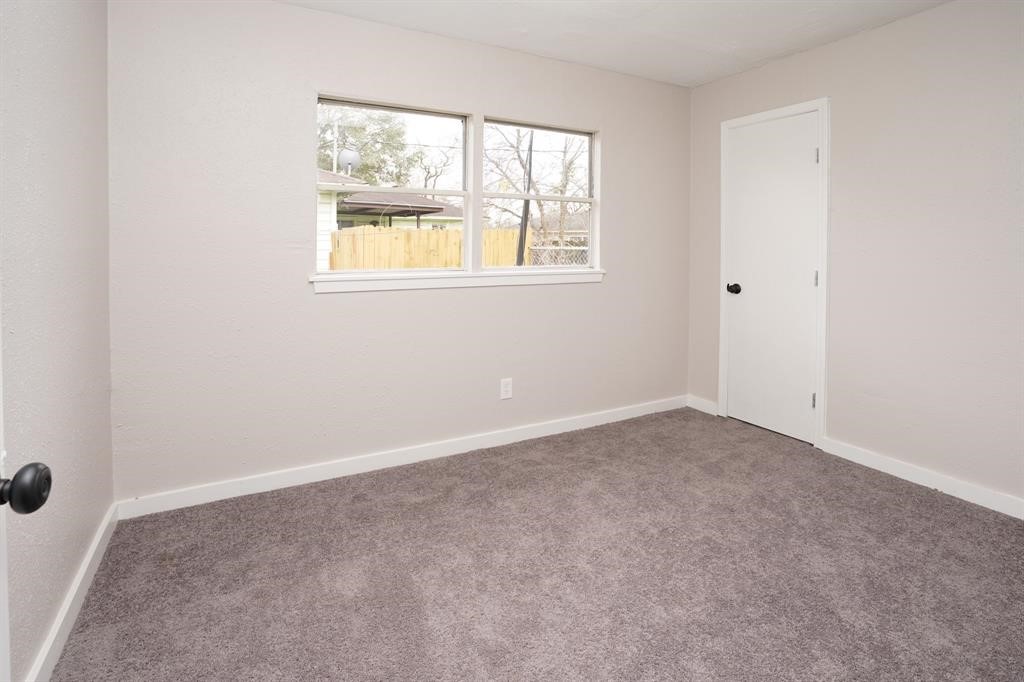 805 Horncastle Street Channelview, TX 77530 - Photo 11 of 12 an empty room with windows