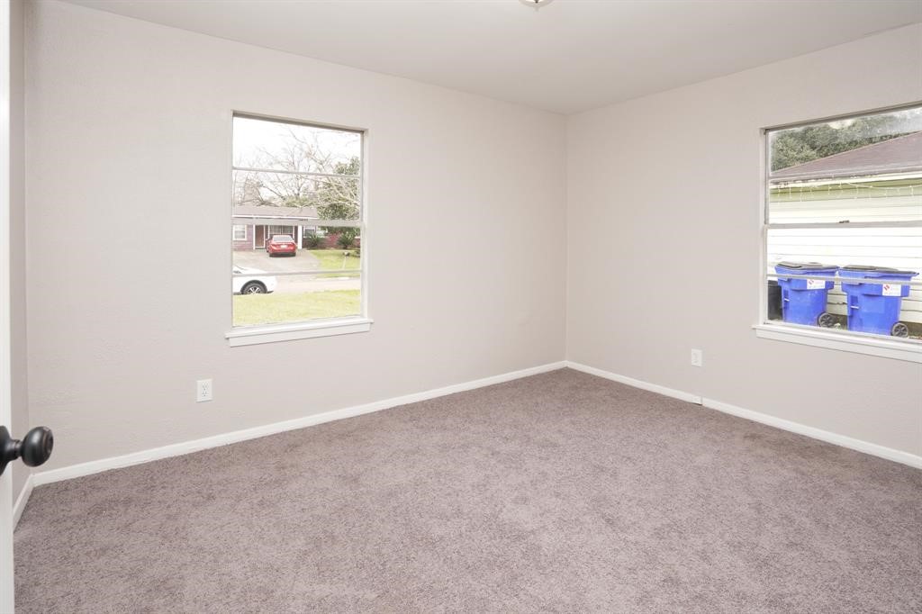 805 Horncastle Street Channelview, TX 77530 - Photo 12 of 12 an empty room with windows