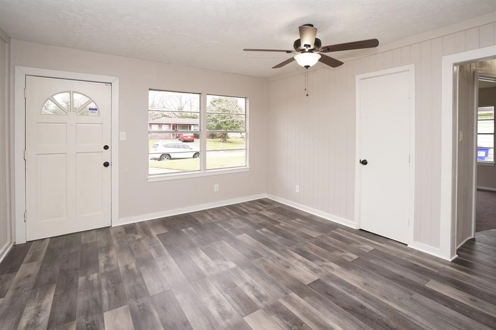 805 Horncastle Street Channelview, TX 77530 - Photo 2 of 12 wooden floor in an empty room with a window