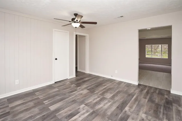 a view of an empty room with a window