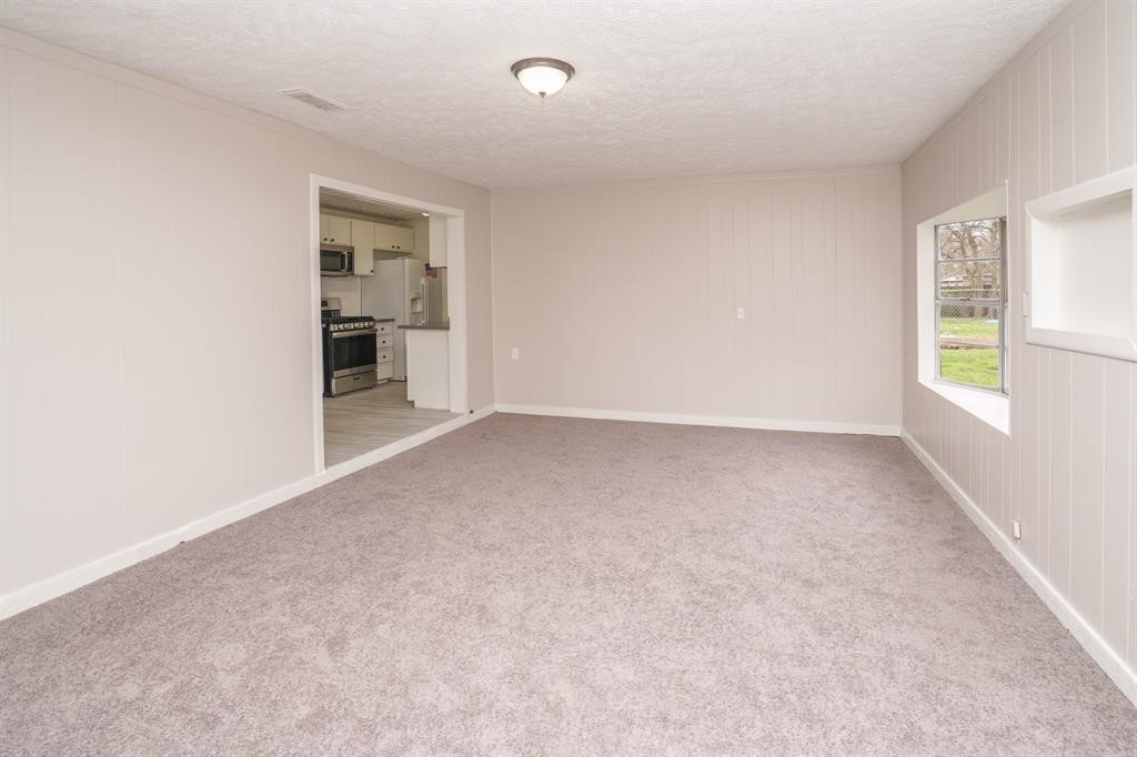 805 Horncastle Street Channelview, TX 77530 - Photo 8 of 12 an empty room with windows