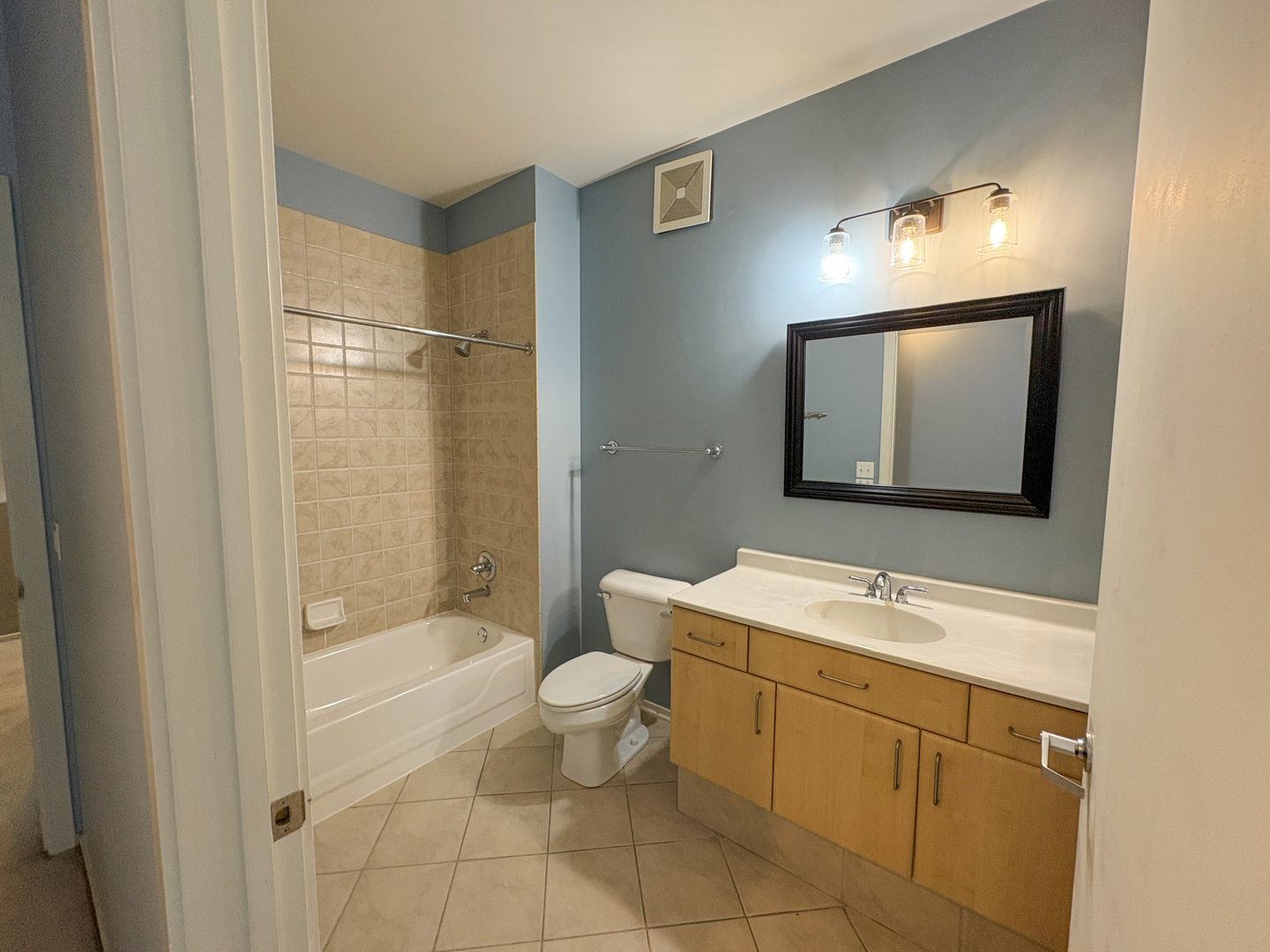 130 South Canal Street, Unit 9M Chicago, IL 60606 - Photo 12 of 14 a bathroom with a toilet sink and mirror