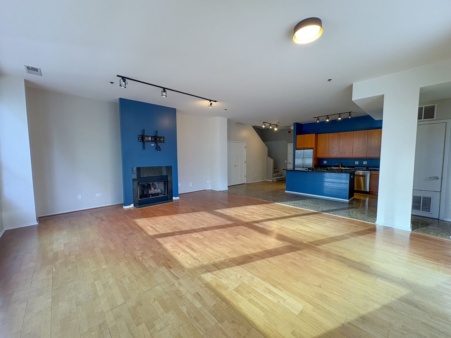 130 South Canal Street, Unit 9M Chicago, IL 60606 - Photo 5 of 14 a room with a bed and a view of kitchen