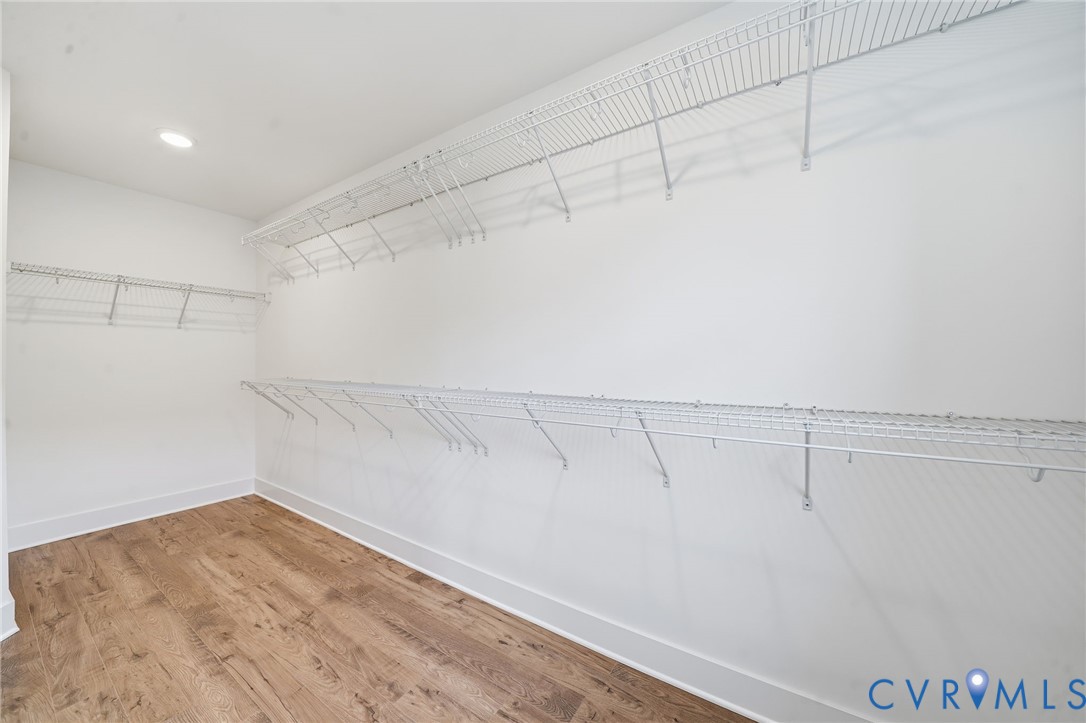12049 Flowering Lavender Loop Henrico, VA 23233 - Photo 16 of 29 a view of a room with racks on the wall