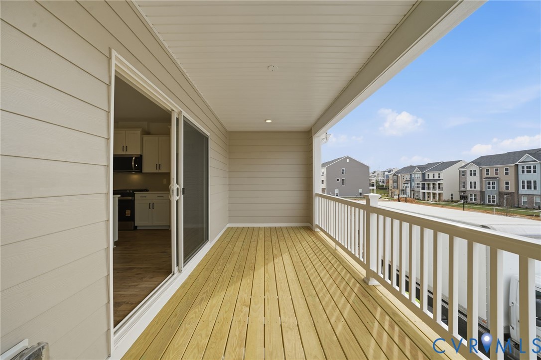 12049 Flowering Lavender Loop Henrico, VA 23233 - Photo 20 of 29 a view of balcony with wooden floor