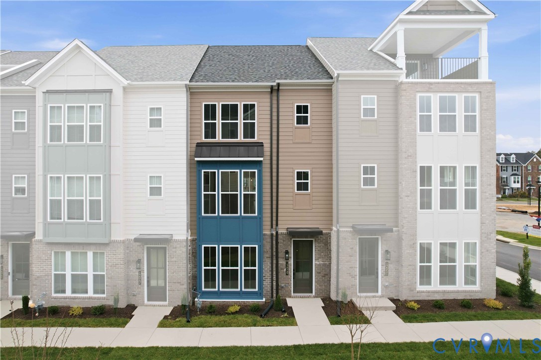 12049 Flowering Lavender Loop Henrico, VA 23233 - Photo 2 of 29 a front view of a house with a yard