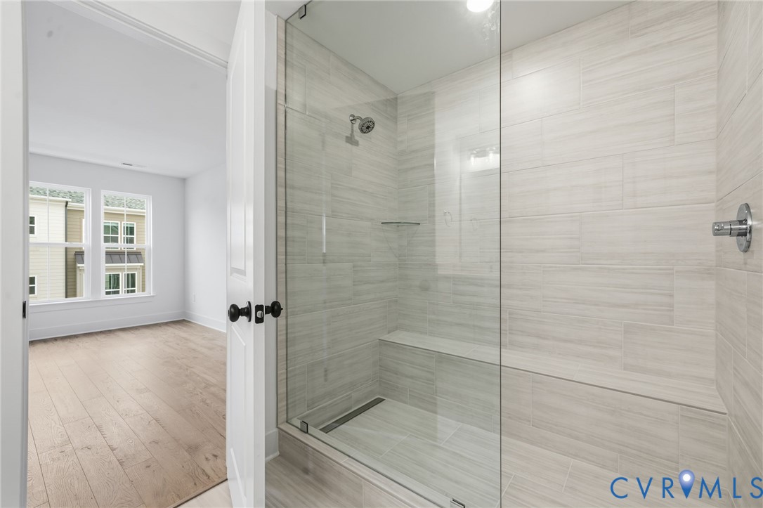 12049 Flowering Lavender Loop Henrico, VA 23233 - Photo 5 of 29 a bathroom with a shower and a sink