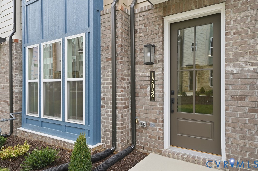 12049 Flowering Lavender Loop Henrico, VA 23233 - Photo 6 of 29 a view of house with a door and a window