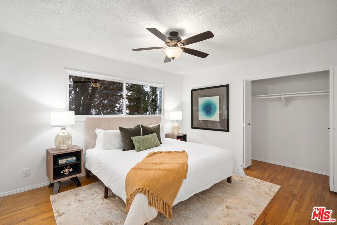 1012 Rose Avenue Venice, CA 90291 - Photo 17 of 27 a bedroom with a bed and wooden floor