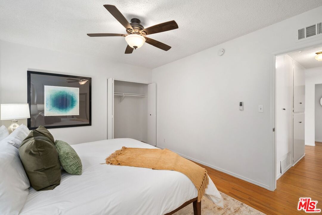 1012 Rose Avenue Venice, CA 90291 - Photo 18 of 27 a bedroom with a bed and a painting on the wall