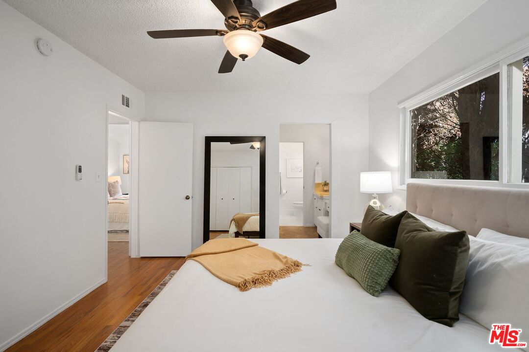 1012 Rose Avenue Venice, CA 90291 - Photo 20 of 27 a bedroom with a bed ceiling fan and a window