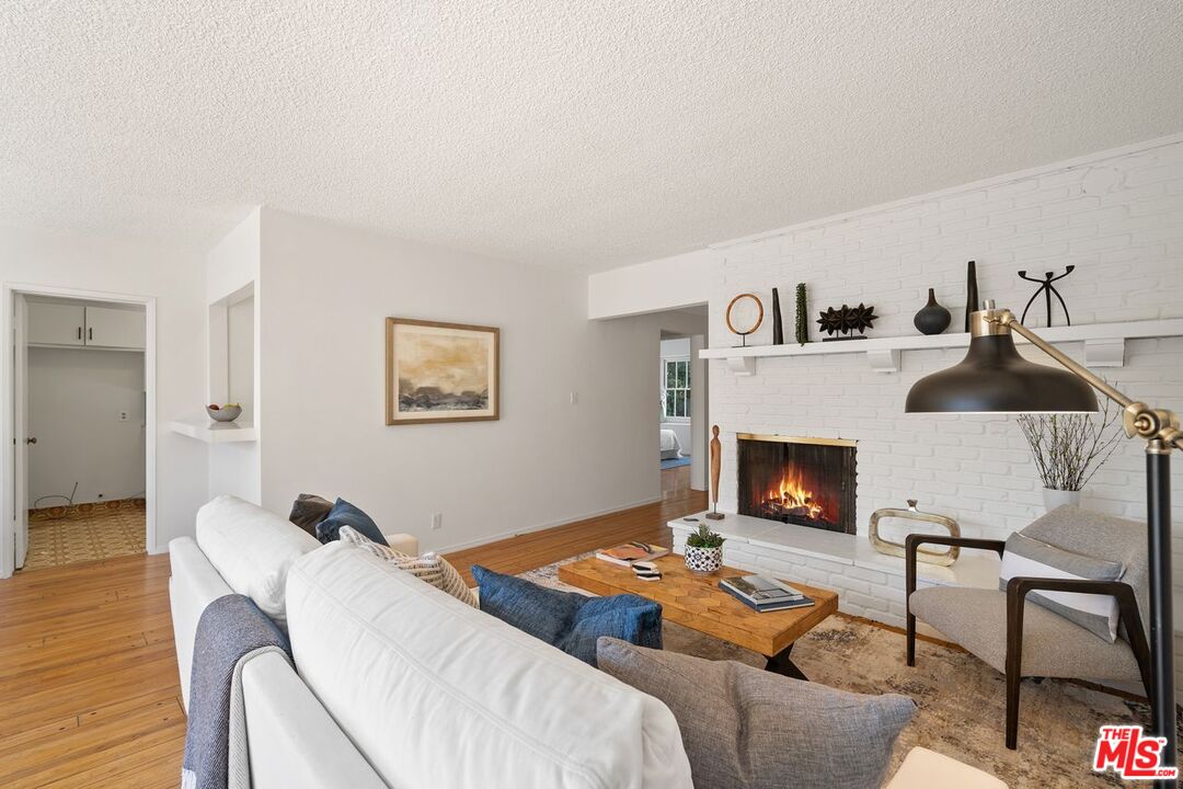 1012 Rose Avenue Venice, CA 90291 - Photo 5 of 27 a bedroom with furniture and a fireplace