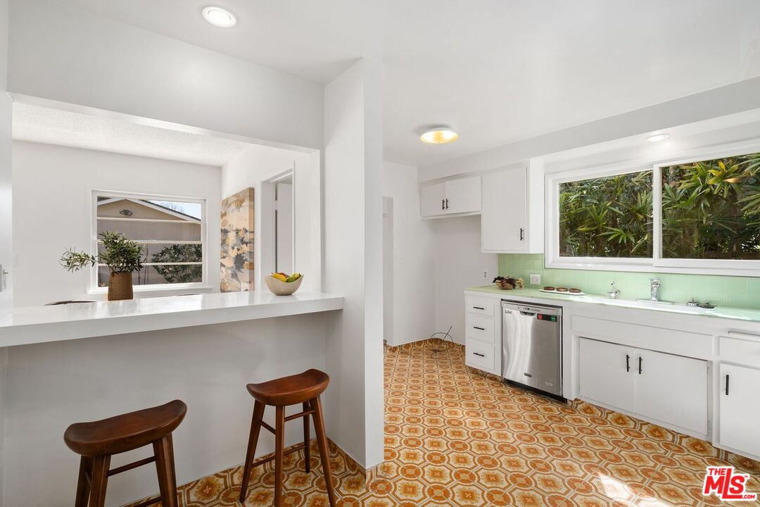 1012 Rose Avenue Venice, CA 90291 - Photo 10 of 27 a kitchen with a sink and chairs