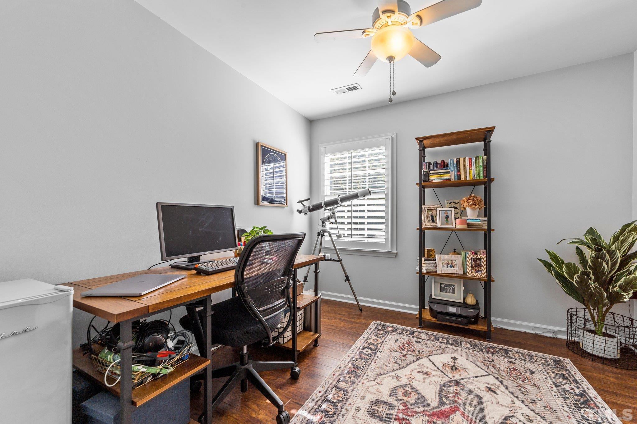 5216 Halcott Court Raleigh, NC 27613 - Photo 11 of 22 a view of a workspace with furniture and a window