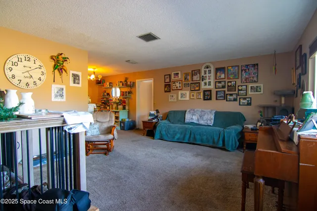 a bedroom with furniture and flat screen tv
