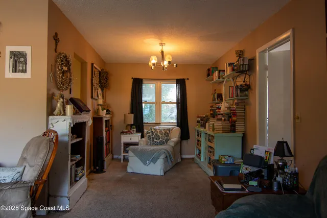 a kitchen with stainless steel appliances kitchen island granite countertop a sink a stove and cabinets