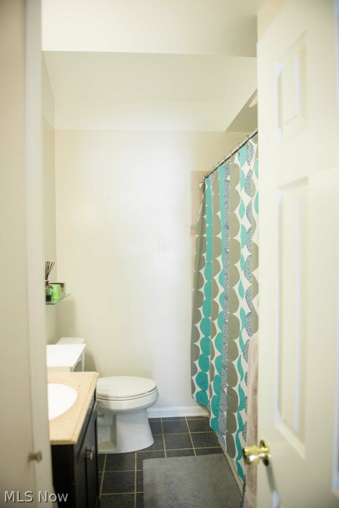 1267 Roland Road Lyndhurst, OH 44124 - Photo 16 of 24 Main floor bath boasts ceramic flooring and ceramic tub/shower surround.