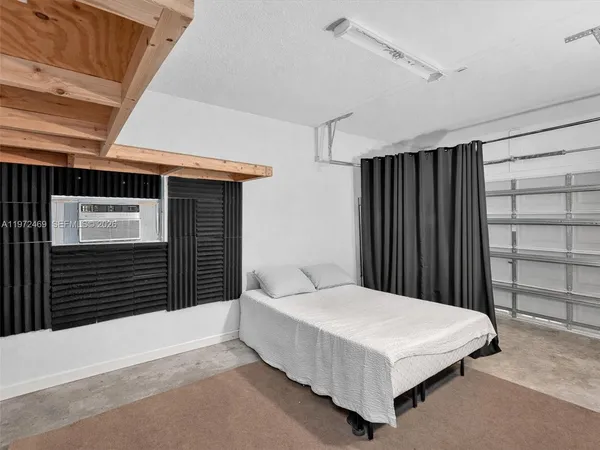 a bedroom with a bed and a cabinets