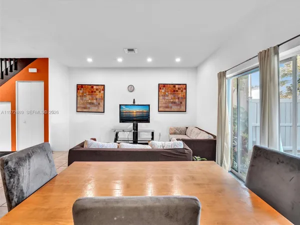 a bedroom with a large bed and a couch