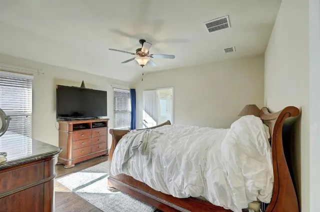 a bedroom with a bed and a dresser