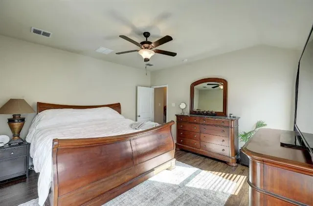 a bathroom with a sink and a mirror with shower