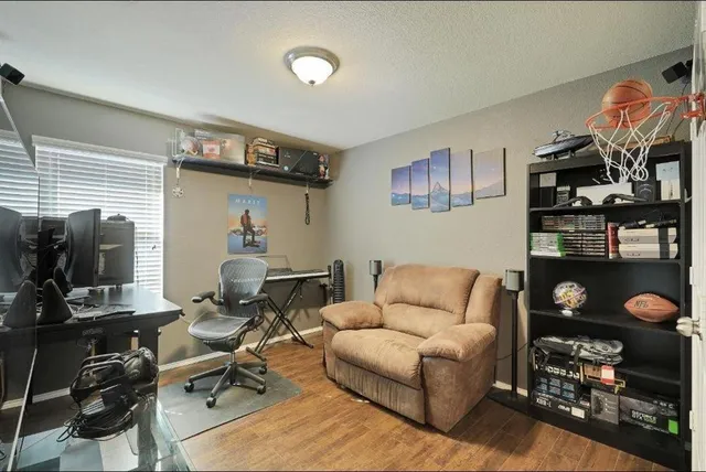 a view of a patio with table and chairs with wooden floor and fence