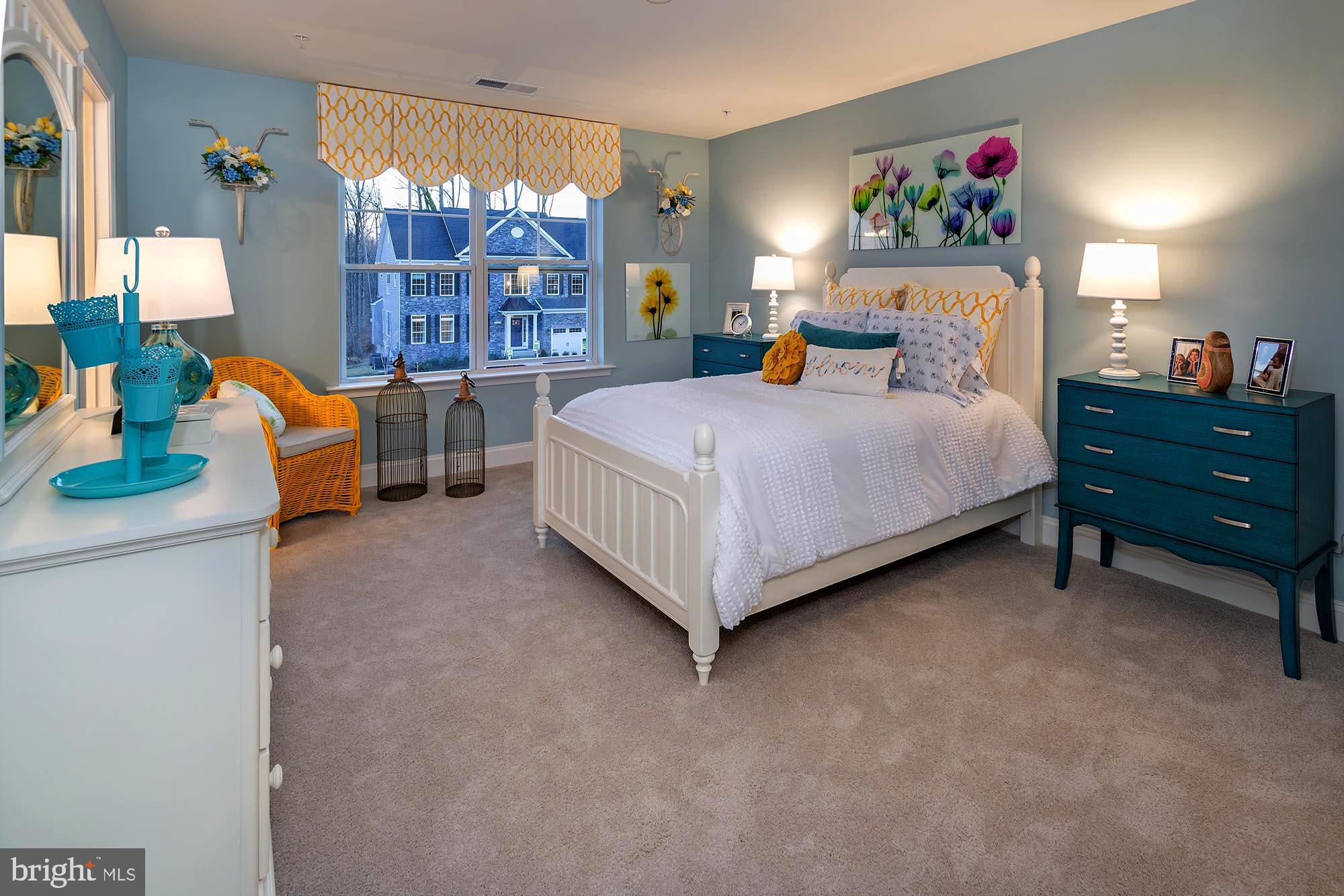 14617 Good Hope Road Silver Spring, MD 20905 - Photo 18 of 29 a bedroom with a bed table and a large window