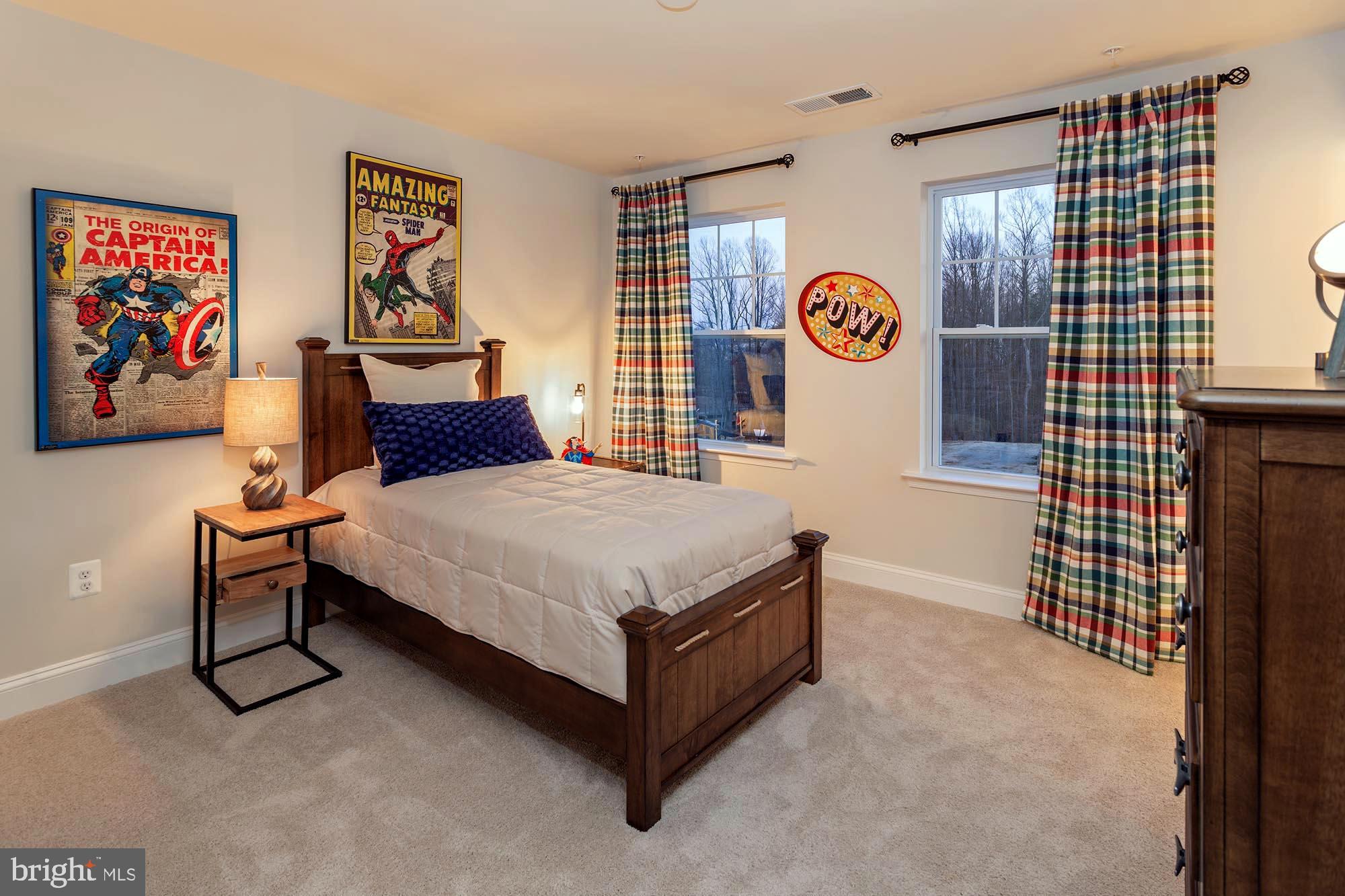 14617 Good Hope Road Silver Spring, MD 20905 - Photo 19 of 29 a spacious bedroom with a bed and a cabinets