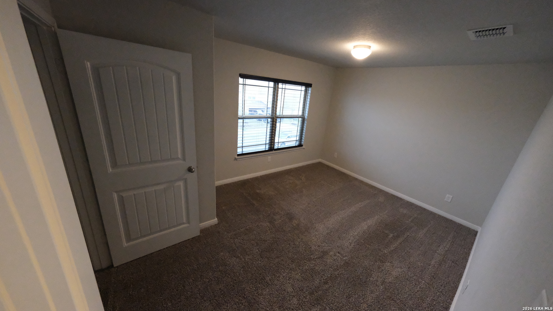 10335 Midsummer Converse, TX 78109 - Photo 15 of 24 an empty room with windows